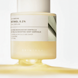 Skin1004 Madagascar Centella Retinol 0.2% Boosting Shot Ampoule in a 30ML bottle, showcasing the skincare product with a focus on its packaging.