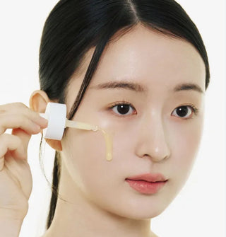 Skin1004 Madagascar Centella Retinol 0.2% Boosting Shot Ampoule 30ML bottle with clear label and dropper applicator.