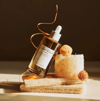 Skin1004 Madagascar Centella Ampoule serum in a 30ml bottle, showcasing the clear, soothing skincare product with a white pump dispenser.