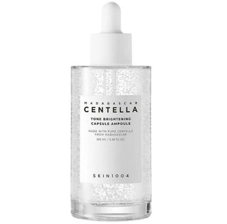 Skin1004 Madagascar Centella Brightening Capsule Ampoule serum in a 30ml bottle with a dropper cap.