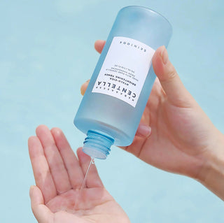 Skin1004 Madagascar Centella Hyalu-Cica Brightening Toner in a 30ml bottle, featuring clear liquid and minimalist label design.