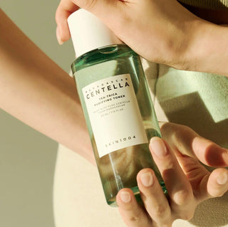 Skin1004 Madagascar Centella Tea-Trica Purifying Toner in a 210ml bottle, with a clear label and a pump dispenser.