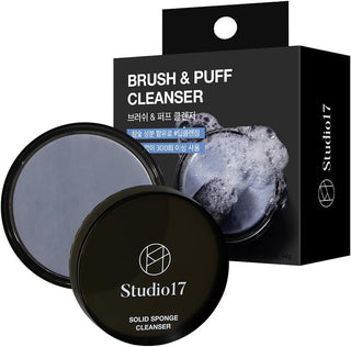 Studio 17 Brush and Puff Cleanser for makeup tools, featuring a bottle with a pump and cleaning brush on a white background.