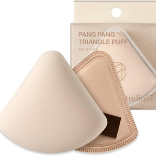Studio 17 Pang Pang Triangle Puff makeup tool for applying powder or foundation, featuring a soft, angled sponge design.