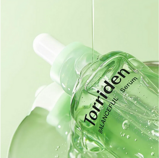 Torriden Balanceful Cica Serum 50mL bottle with a sleek design, showcasing the nourishing skincare serum for soothing and revitalizing skin.