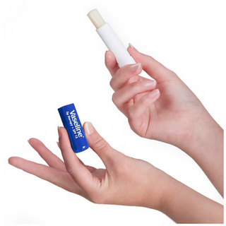 Vaseline Lip Therapy Stick in original scent, 4.6g, showing the white balm stick with Vaseline branding on the packaging